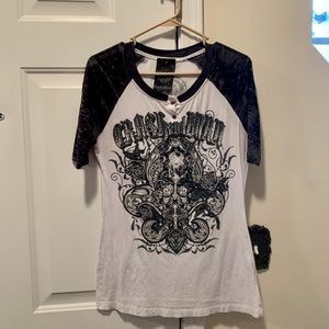 Cool jersey with emblem and shiny grommets on front & back. From Buckle store.